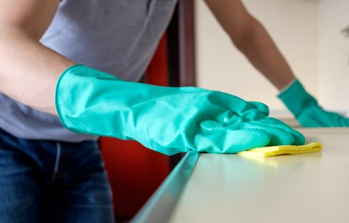 Weekly cleaning schedule checklist on a clipboard