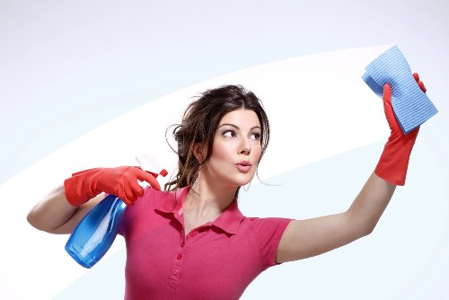 Janitorial staff performing commercial cleaning in a workplace